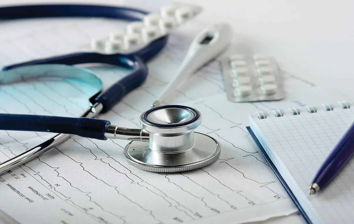 stethoscope-on-the-cardiogram stethoscope on the cardiogram